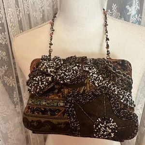 Metal handbag style is Bo-Ho... Beaded 2 straps.